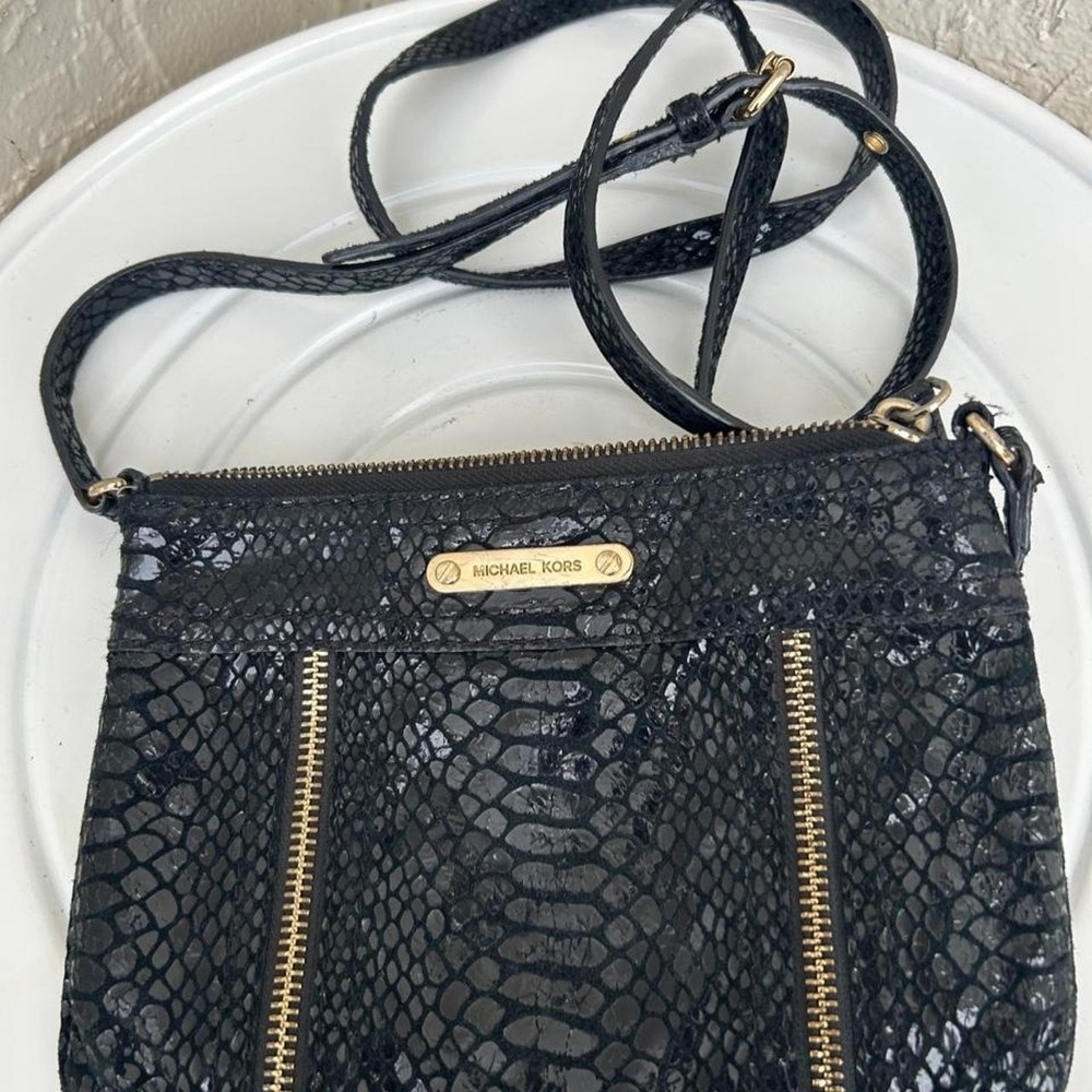 Michael Kors crossbody bag features a textured snake-pattern embossed leather